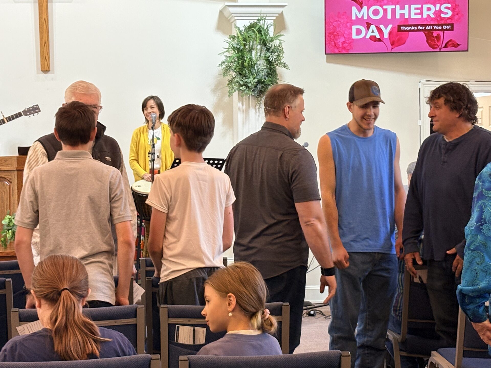 The Ashe Alliance Church family talking after a Sunday service