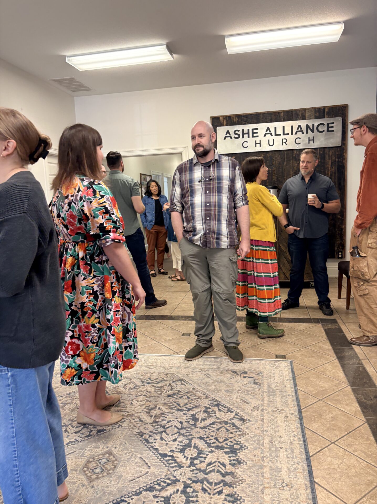 Members of Ashe Alliance Church visiting in the lobby