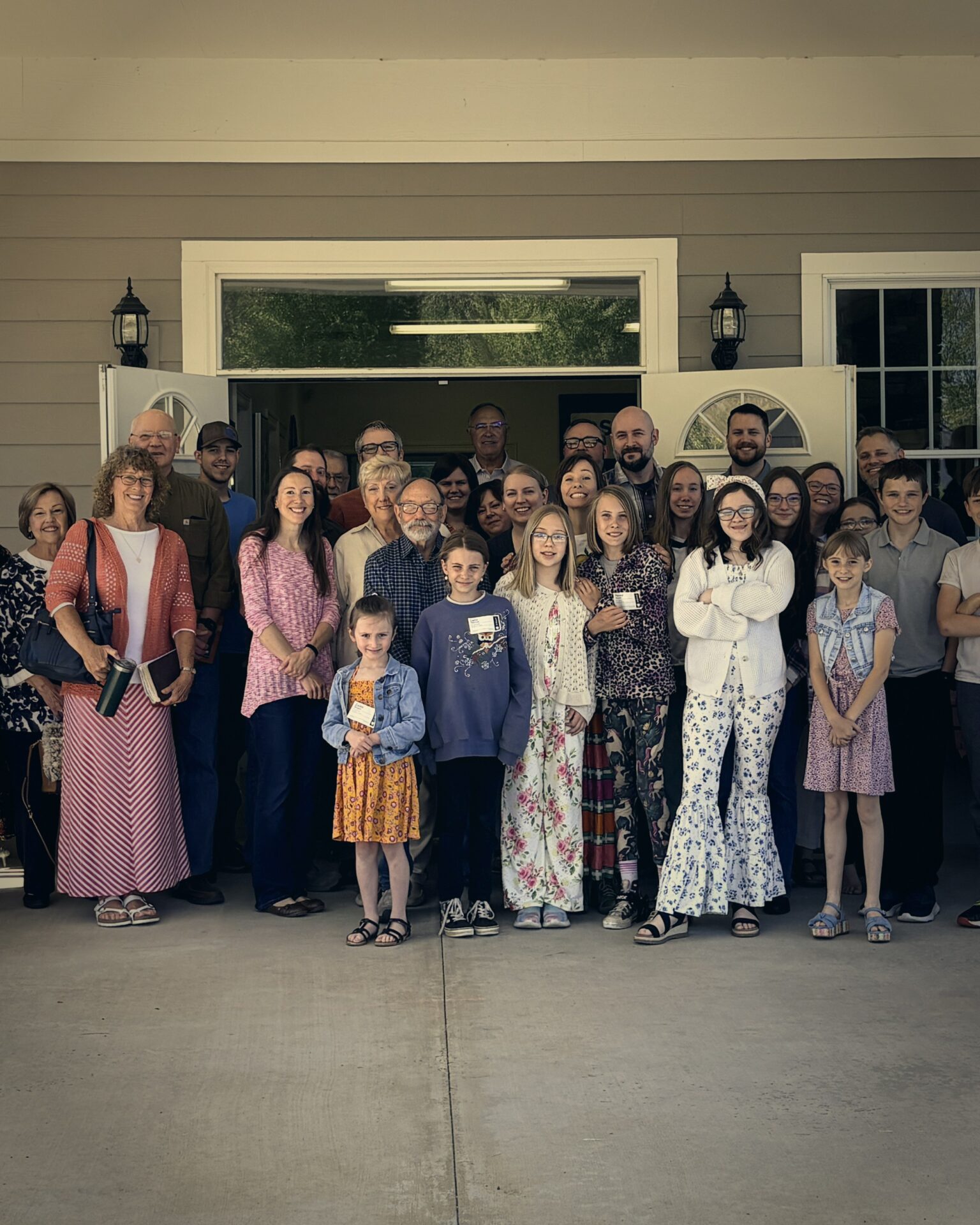 Ashe Alliance congregation gathered outside the church entrance